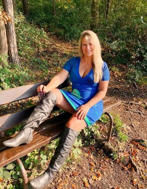 18 year old girl Katie Lewis stands naked after undressing in her bedroom